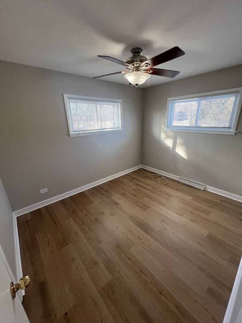 213 67th Street Darien, IL 60561 - Photo 6 of 13 a view of an empty room with a window