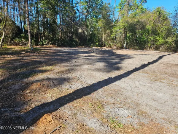 a view of a backyard of the house