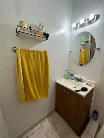 a bathroom with a sink and mirror