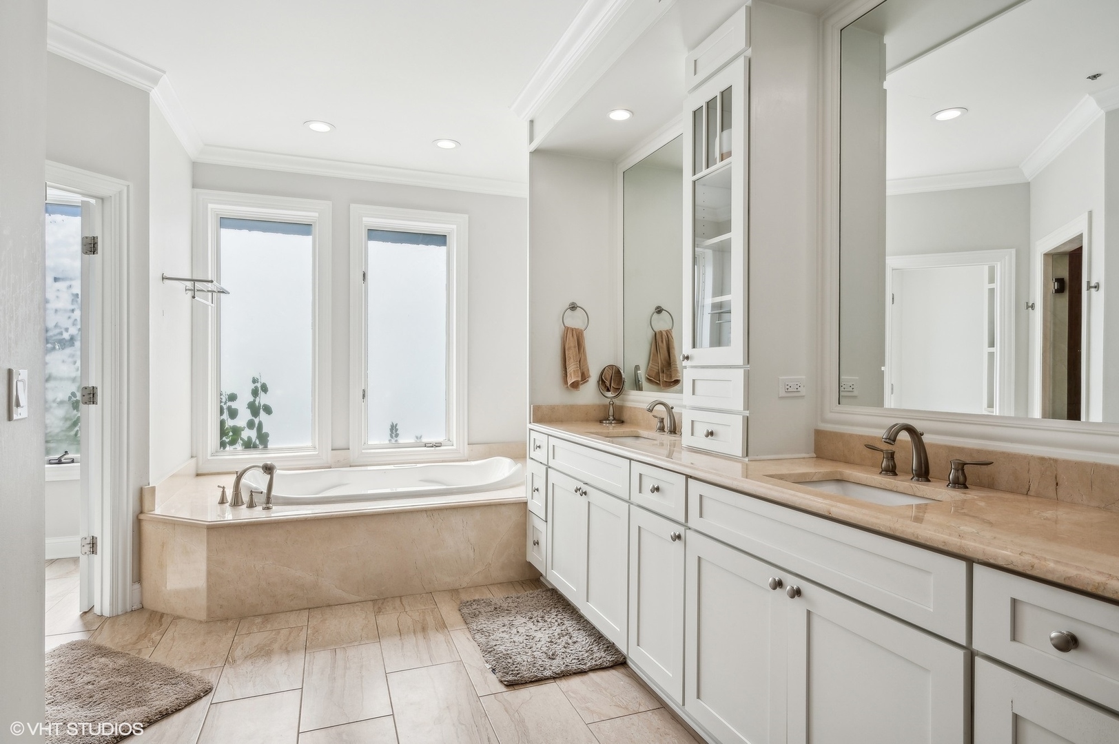 5807 Port Clinton Road Long Grove, IL 60047 - Photo 20 of 40 a large bathroom with a double vanity sink large mirror and a bathtub