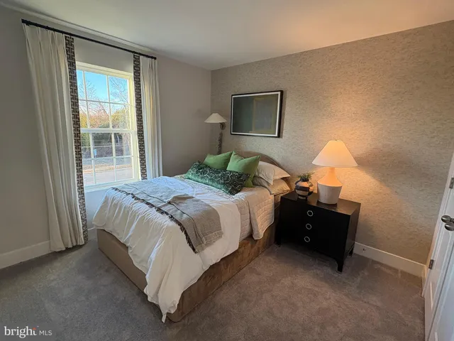 a bedroom with bed and window