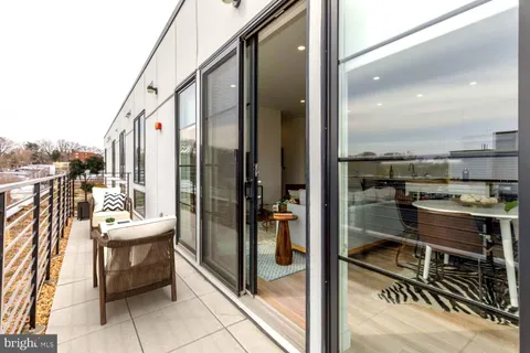 a balcony with a view of living room
