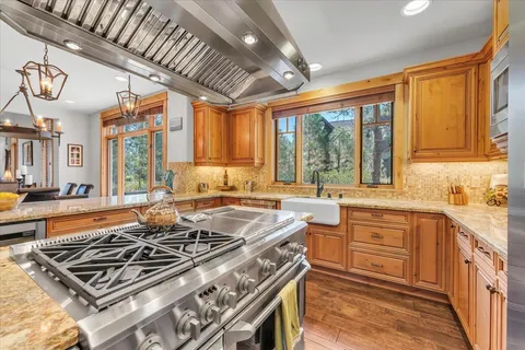 a kitchen with a stove and a sink