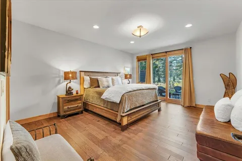 a spacious bedroom with a bed and a couch