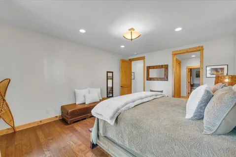 a spacious bathroom with double vanity and a mirror