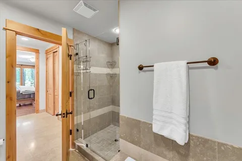 a view of a livingroom with furniture and floor to bedroom