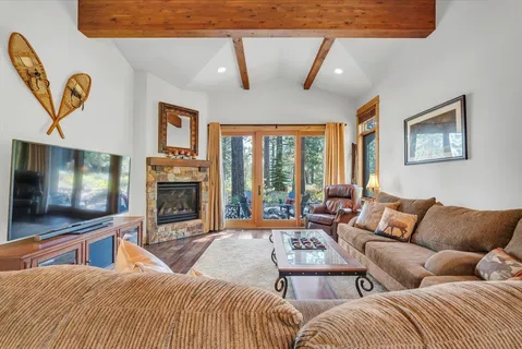 a bedroom with furniture and a flat screen tv