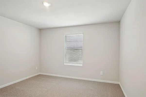 an empty room with closet area