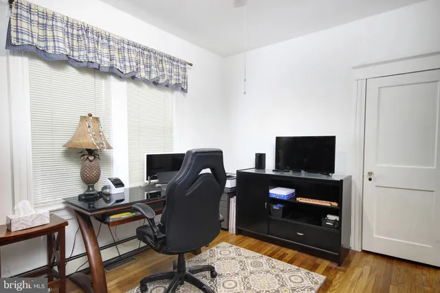 a bedroom with a bed and a window with the outer view