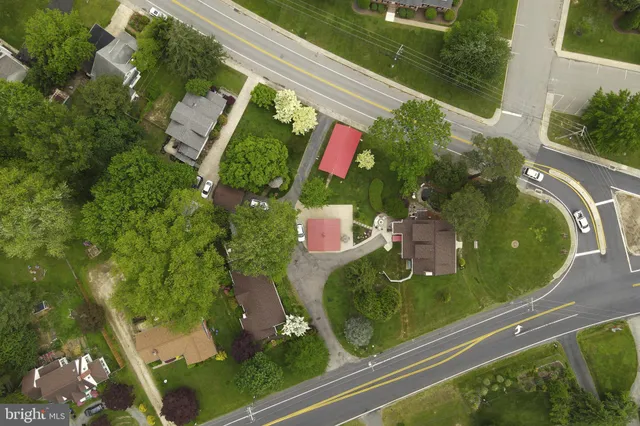 an aerial view of a residential houses with outdoor space