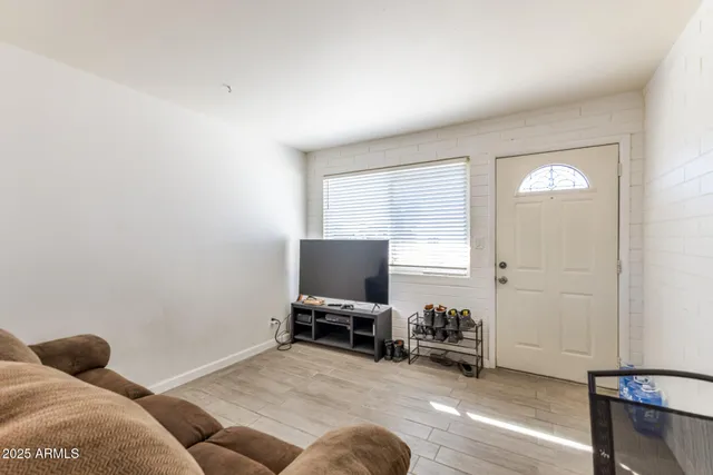 a living room with furniture and a table