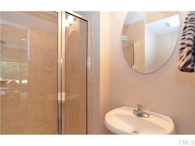 1623 Lorraine Road Raleigh, NC 27607 - Photo 20 of 23 The bathroom in the basement has a fullsize shower, pedestal sink, and pocket door.