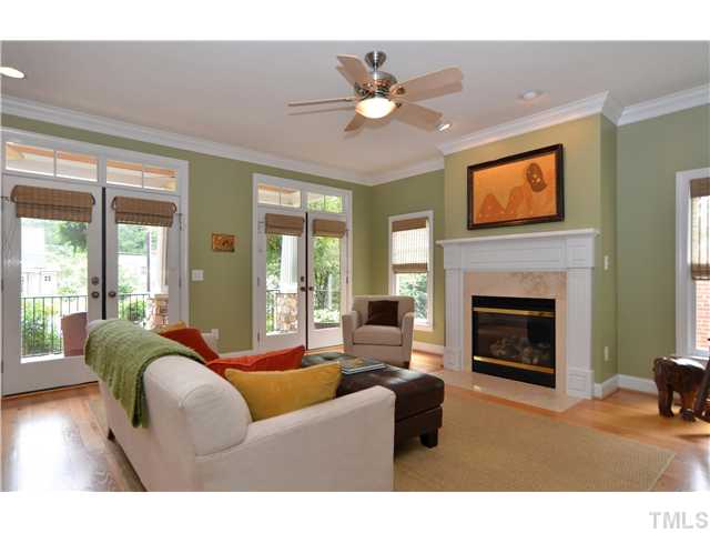 1623 Lorraine Road Raleigh, NC 27607 - Photo 3 of 23 The living room is just beautiful! The french doors with glass transoms and the other windows let lots of soft natural light into the room. There is a gas fireplace and recessed lighting.