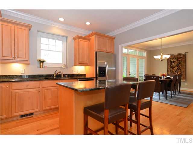 1623 Lorraine Road Raleigh, NC 27607 - Photo 7 of 23 Notice all of the cabinets in this kitchen! There is a ton of storage! The kitchen opens to the living room and to the dining room.