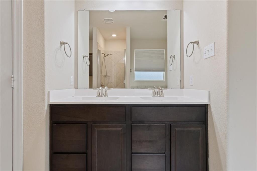 5300 Crossville Drive Waco, TX 76708 - Photo 16 of 33 a bathroom with a sink and a mirror