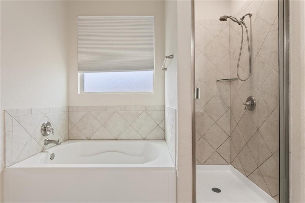5300 Crossville Drive Waco, TX 76708 - Photo 18 of 33 a close up of a bathtub in a bathroom