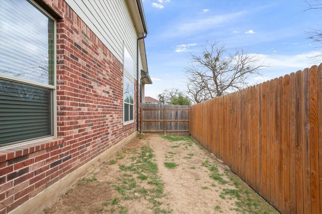 5300 Crossville Drive Waco, TX 76708 - Photo 28 of 33 a view of a backyard with wooden fence