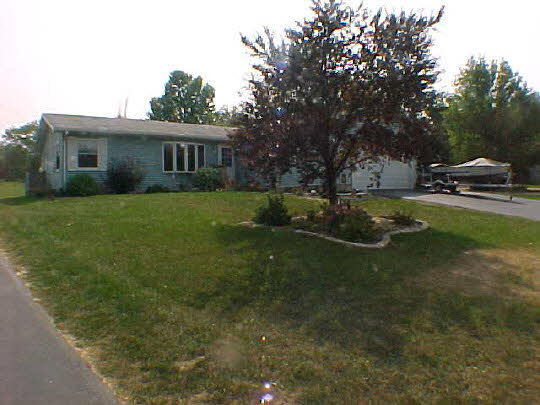 568 Baintree Road Lake Summerset, IL 61019 - Photo 1 of 6 a front view of a house with garden
