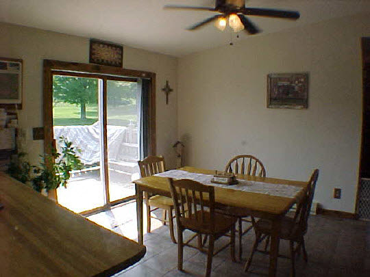 568 Baintree Road Lake Summerset, IL 61019 - Photo 3 of 6 a view of a dining room with furniture window and wooden floor