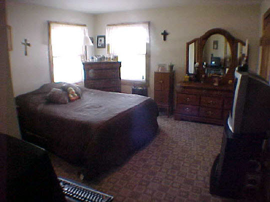 568 Baintree Road Lake Summerset, IL 61019 - Photo 5 of 6 a bedroom with a bed and dresser