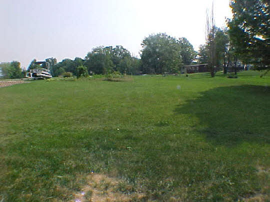 568 Baintree Road Lake Summerset, IL 61019 - Photo 6 of 6 a view of a grassy field with trees