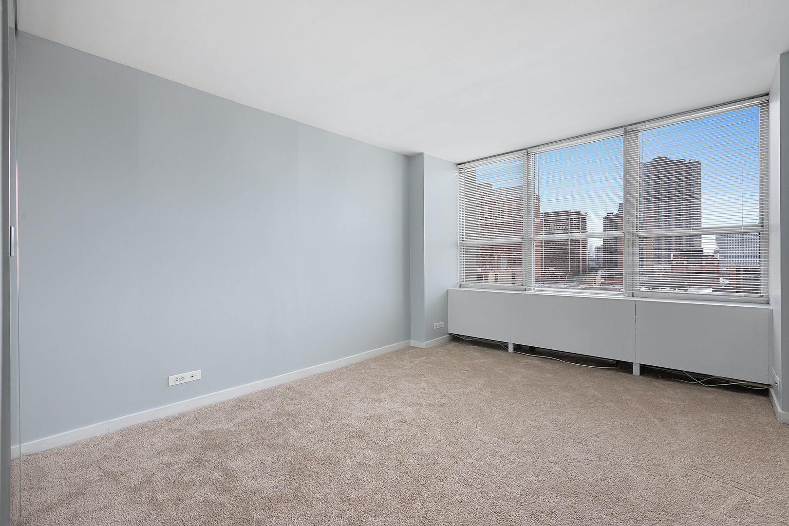655 West Irving Park Road, Unit 701 Chicago, IL 60613 - Photo 33 of 39 a view of an empty room with a window