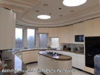 24 Clem Conover Road Deal, NJ 07723 - Photo 8 of 14 a bathroom with a sink a large mirror and a bathtub