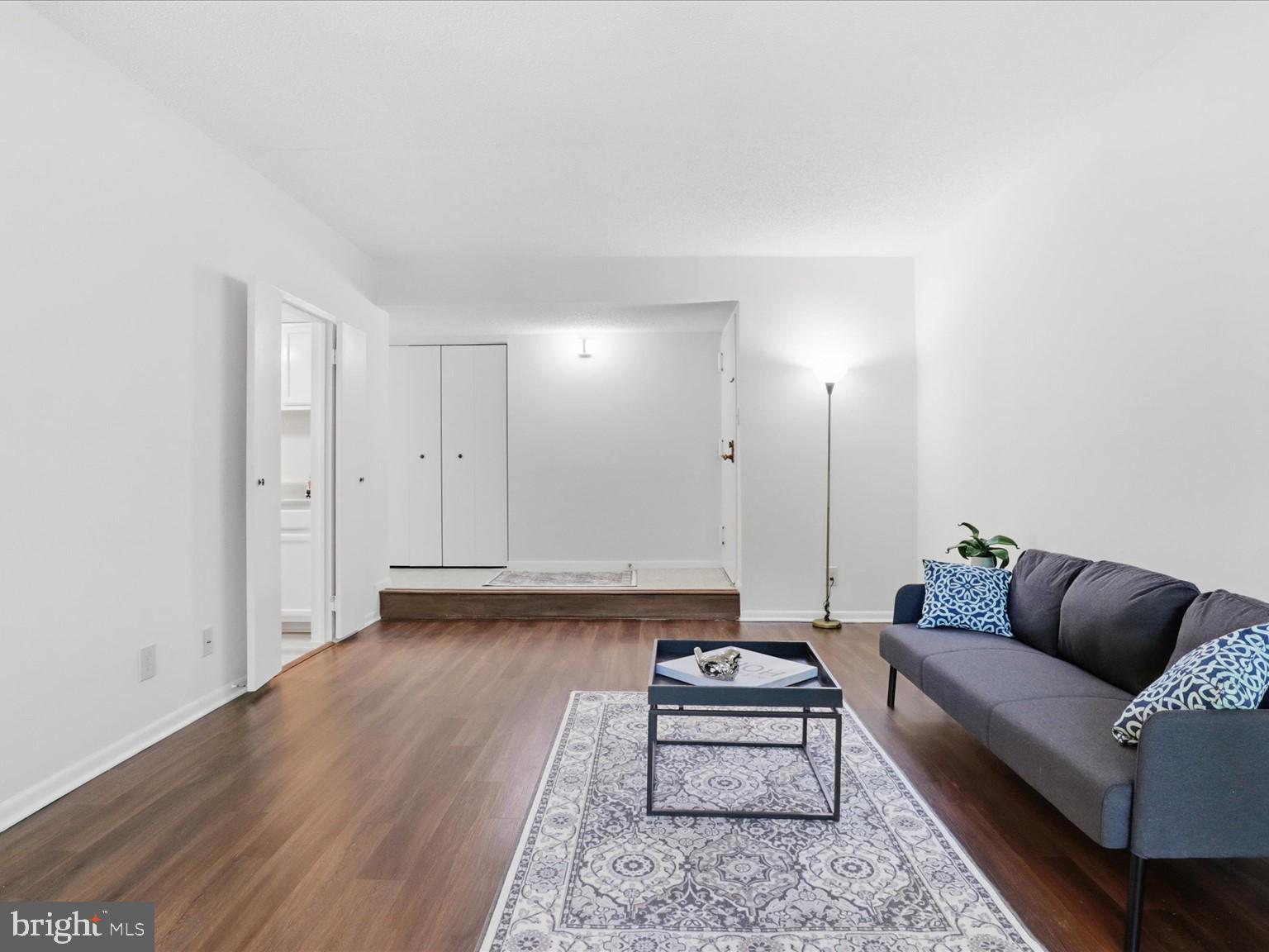 11809 Breton Court, Unit 2B Reston, VA 20191 - Photo 14 of 29 a living room with furniture and a couch