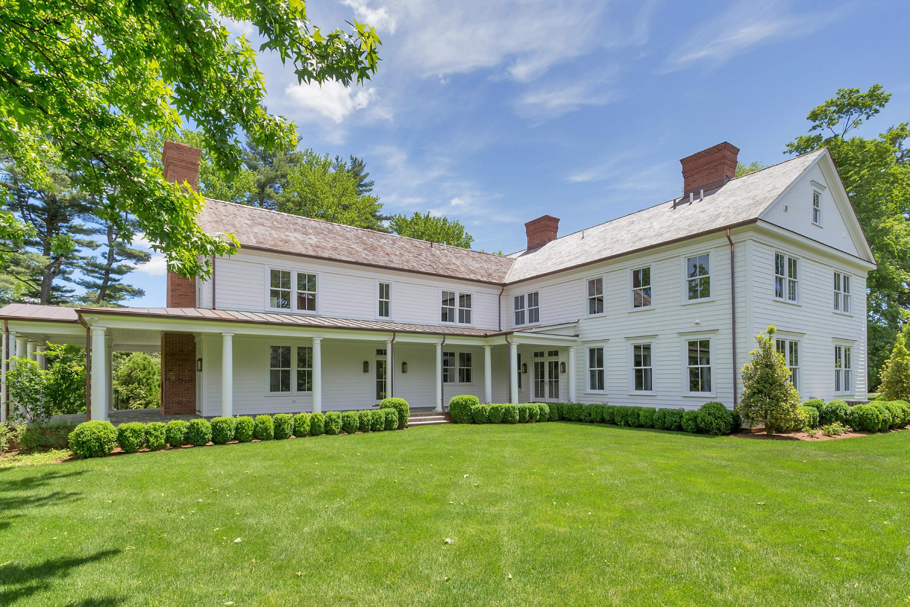 6 A Cross Road Darien, CT 06820 - Photo 23 of 24 front view of a house with a garden