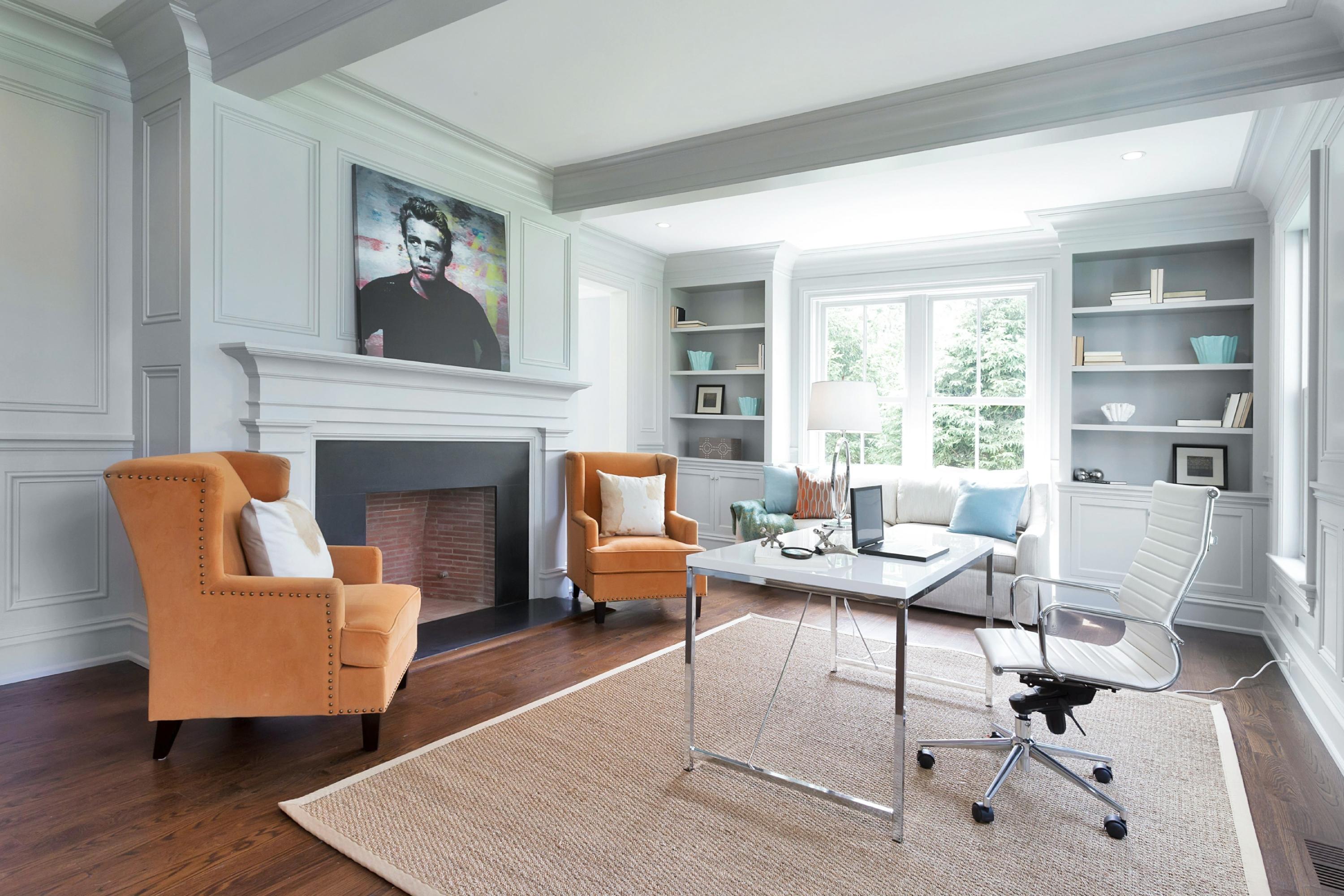 6 A Cross Road Darien, CT 06820 - Photo 7 of 24 a living room with furniture a fireplace and a table