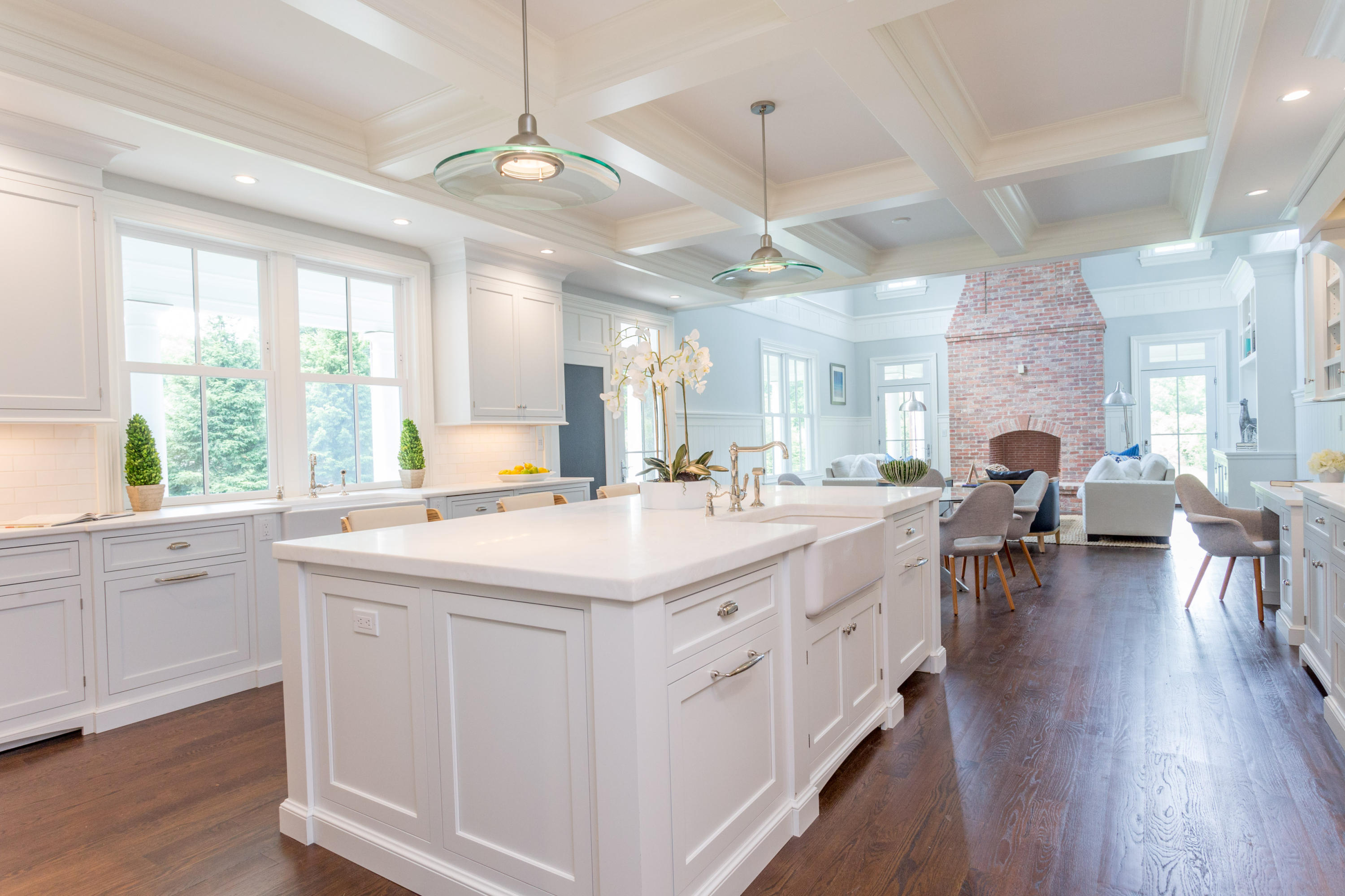 6 A Cross Road Darien, CT 06820 - Photo 10 of 24 a large white kitchen with lots of counter top space and living room