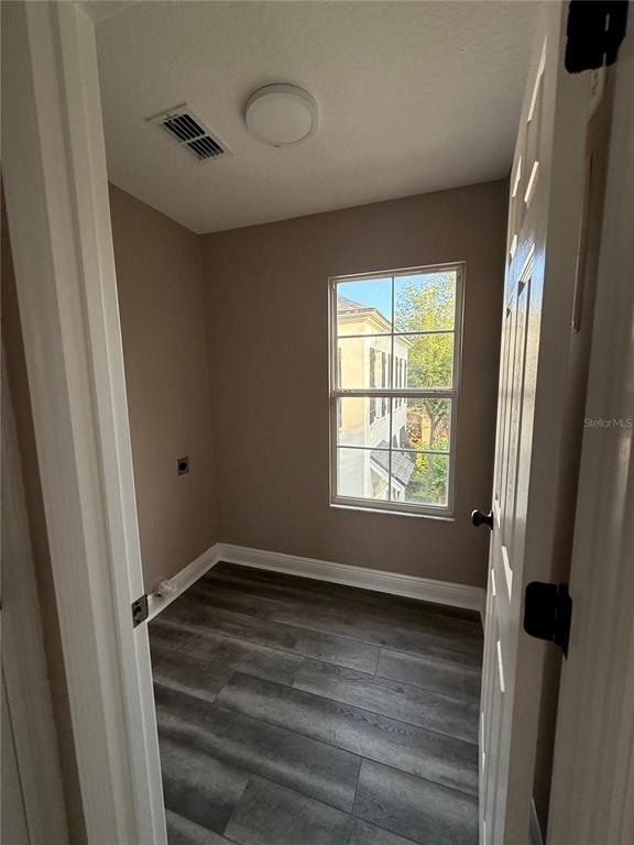 1115 Damask Street Celebration, FL 34747 - Photo 14 of 17 a view of an empty room with a window