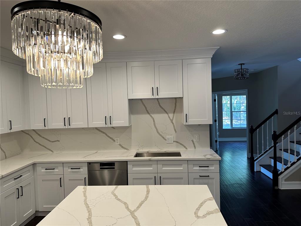 1115 Damask Street Celebration, FL 34747 - Photo 3 of 17 a kitchen with cabinets and window