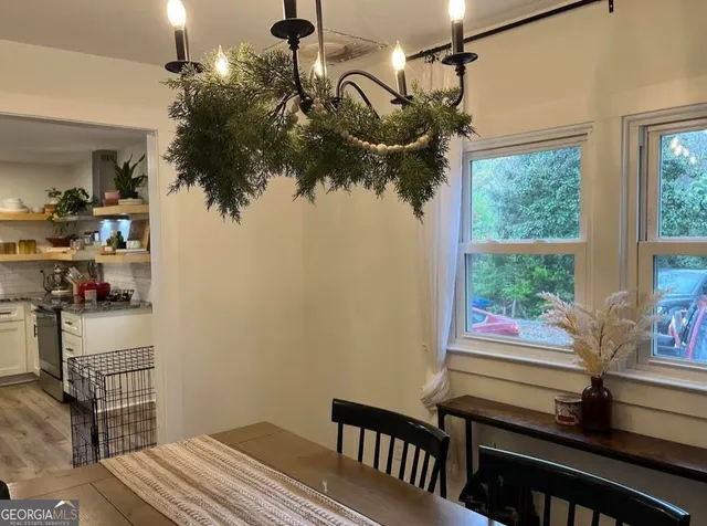 a stove top oven sitting inside of a kitchen