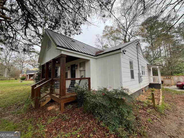a view of living room with furniture and flower pot