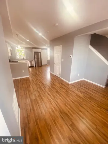 a white toilet sitting next to a shower