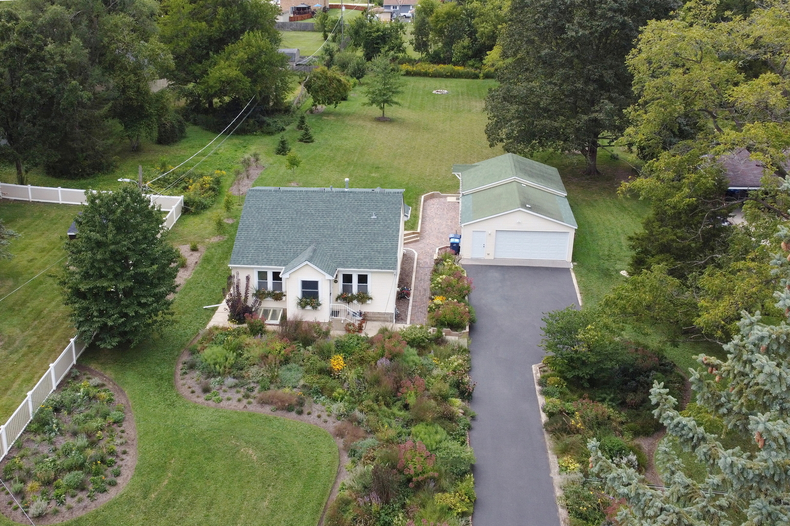 732 Rogers Road Gurnee, IL 60031 - Photo 1 of 44 an aerial view of a house with a yard and lake view