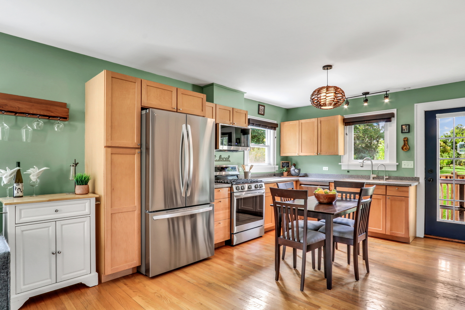 732 Rogers Road Gurnee, IL 60031 - Photo 14 of 44 a kitchen with stainless steel appliances granite countertop a refrigerator and wooden cabinets