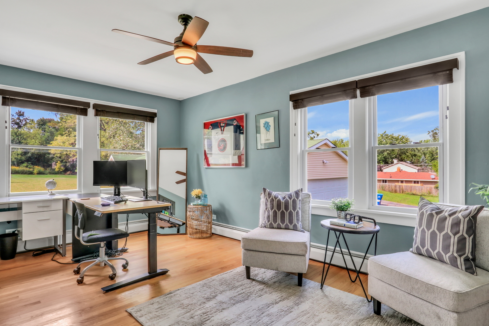 732 Rogers Road Gurnee, IL 60031 - Photo 21 of 44 a living room with furniture floor to ceiling window and a flat screen tv