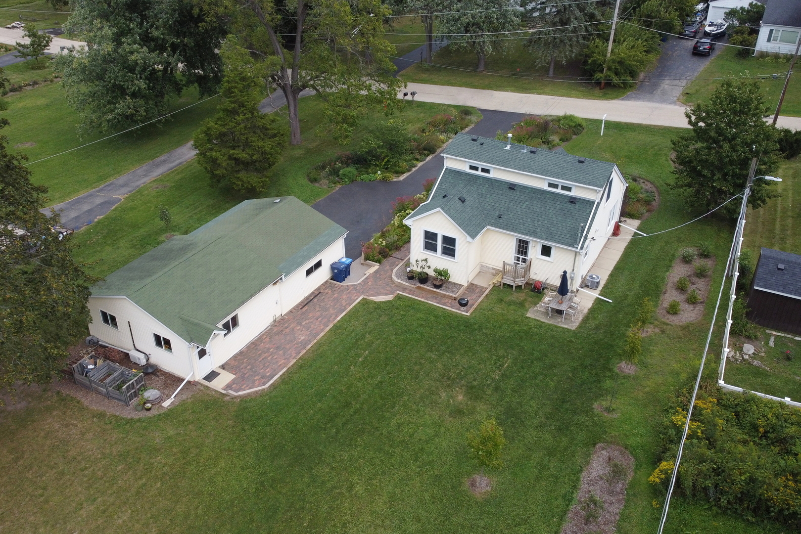 732 Rogers Road Gurnee, IL 60031 - Photo 40 of 44 an aerial view of a house with a garden and lake view