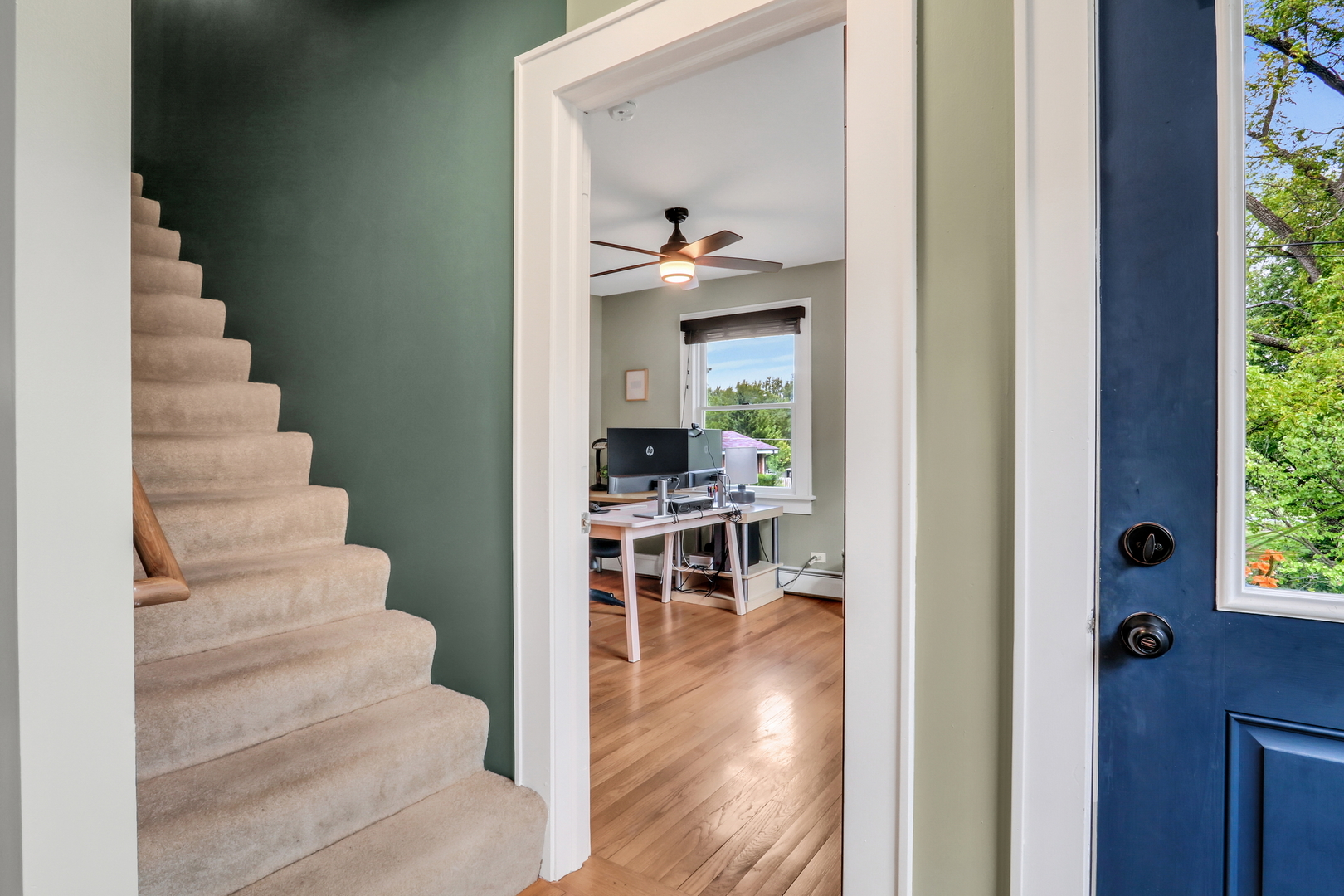 732 Rogers Road Gurnee, IL 60031 - Photo 6 of 44 a view of a hallway with wooden floor and a dining room