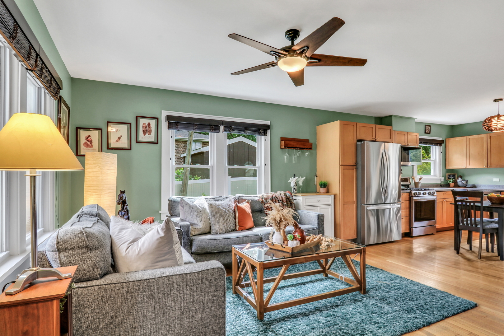732 Rogers Road Gurnee, IL 60031 - Photo 9 of 44 a living room with furniture a dining table and a refrigerator
