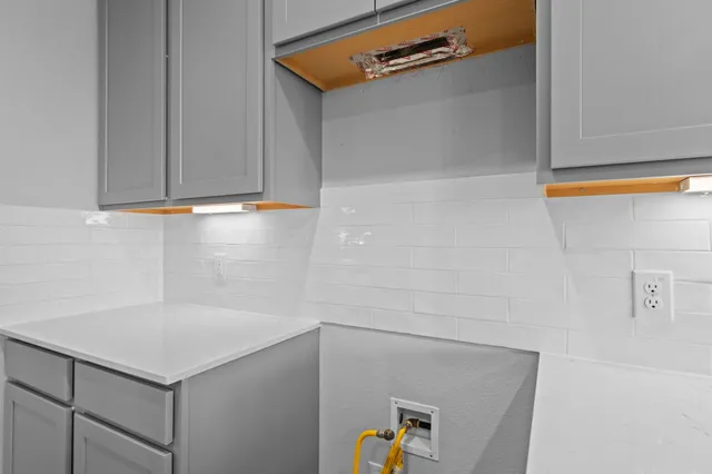 a utility room with cabinets