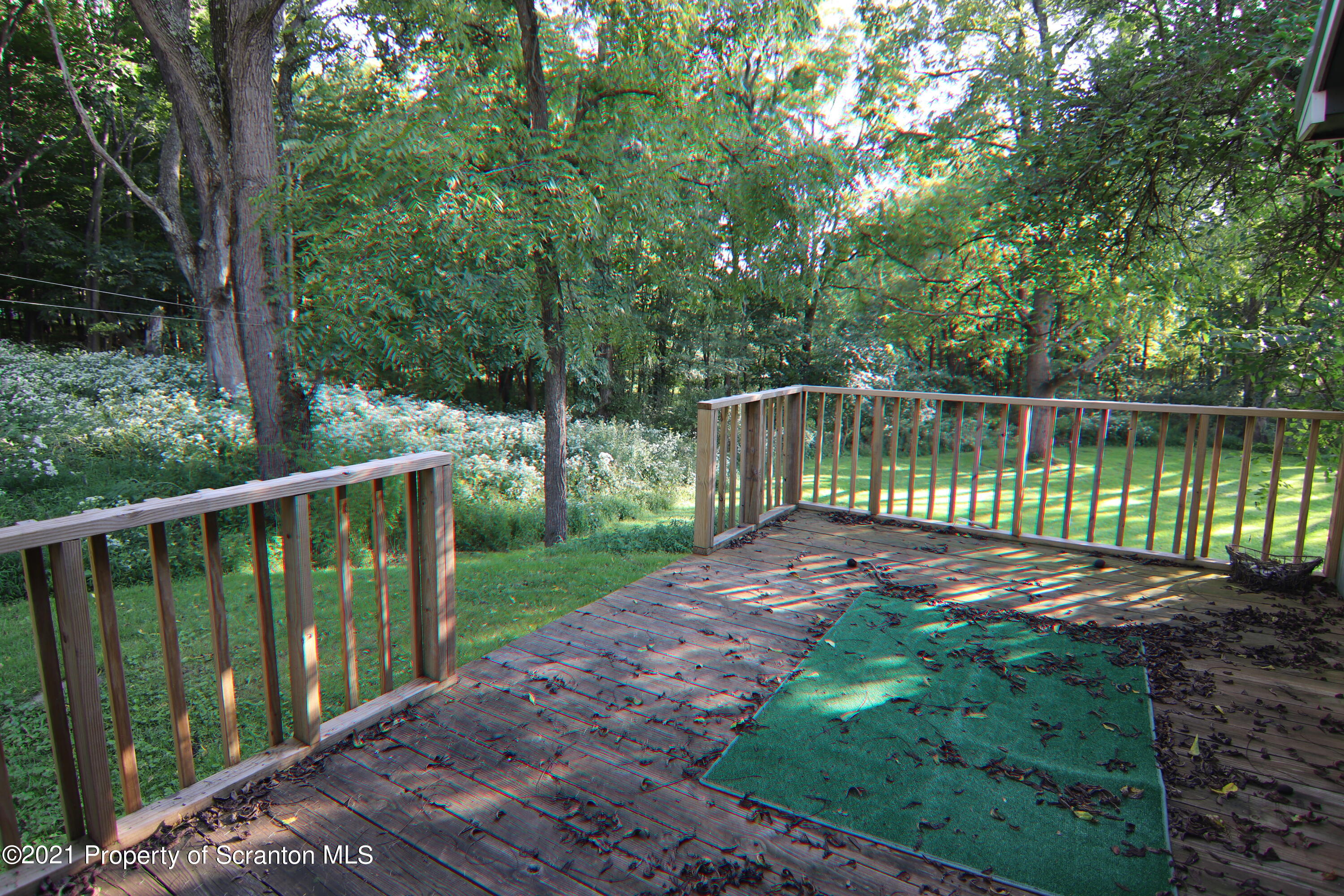 139 Rabbitt Hollow Road Meshoppen, PA 18630 - Photo 36 of 55 a view of a deck with a yard