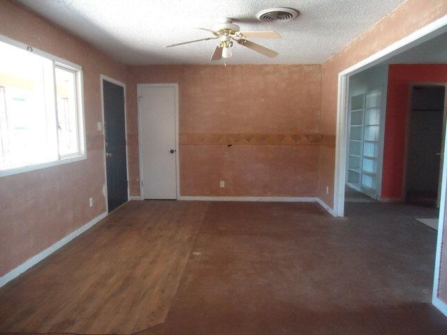 2005 43rd Street Lubbock, TX 79412 - Photo 2 of 10 an empty room with windows and fan