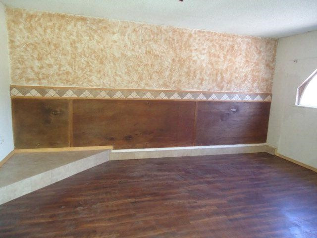 2005 43rd Street Lubbock, TX 79412 - Photo 3 of 10 a view of an empty room with wooden floor and a window