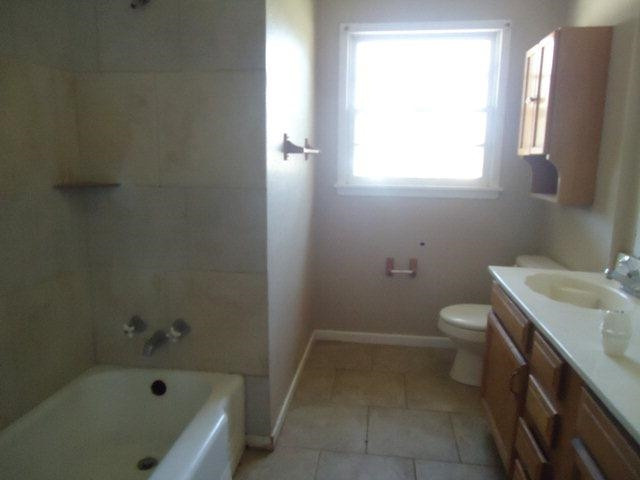 2005 43rd Street Lubbock, TX 79412 - Photo 6 of 10 a bathroom with a sink a toilet and bathtub