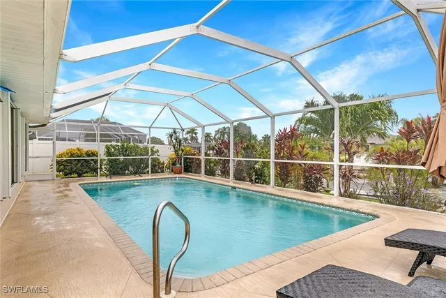 a view of a swimming pool with a lounge chairs