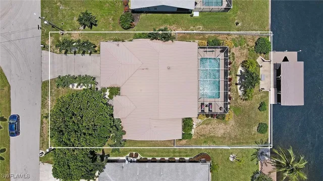 an aerial view of a house with a ocean view
