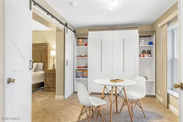 a bedroom with a bed and dresser